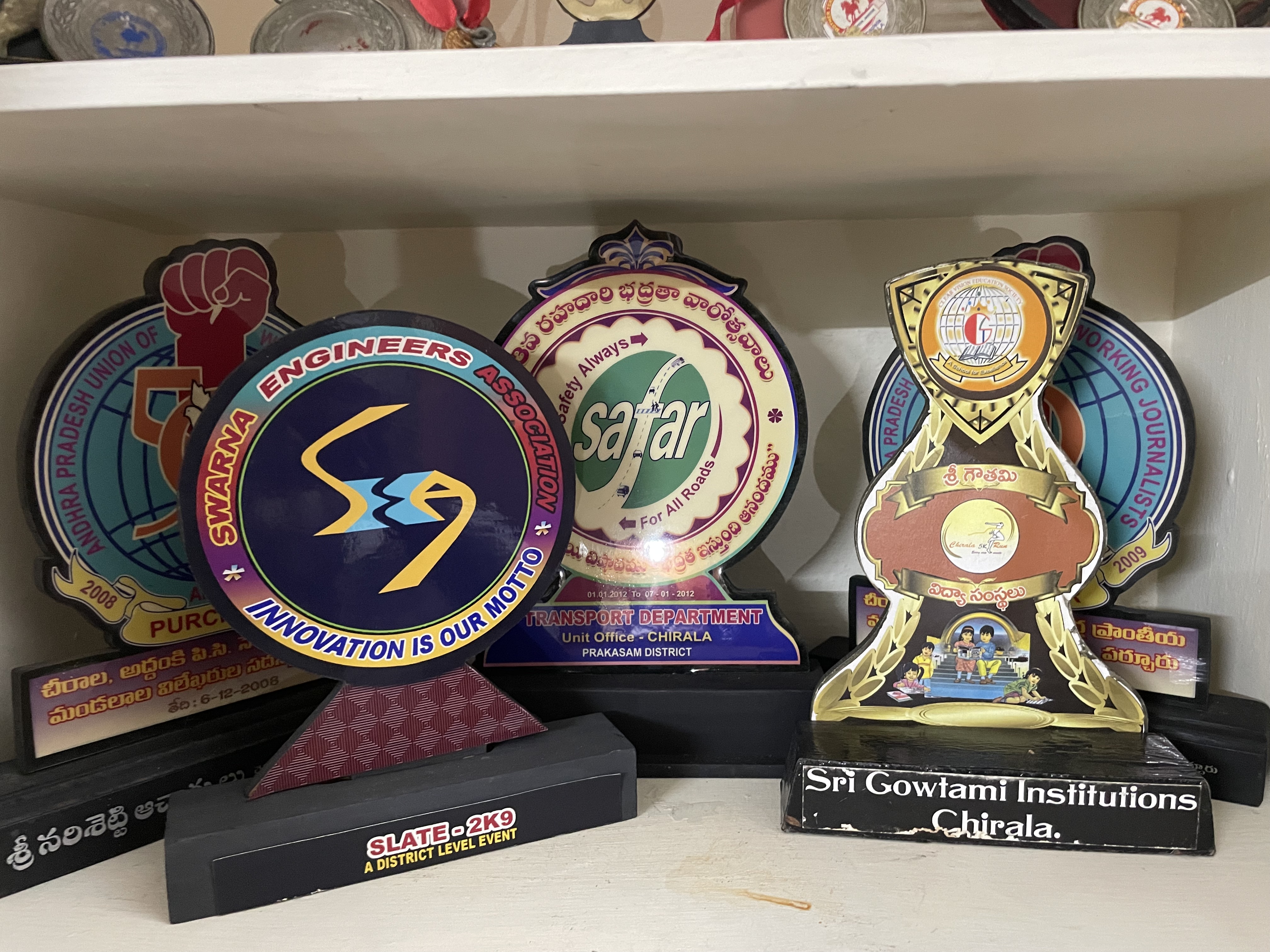 Plaques and medals on shelf