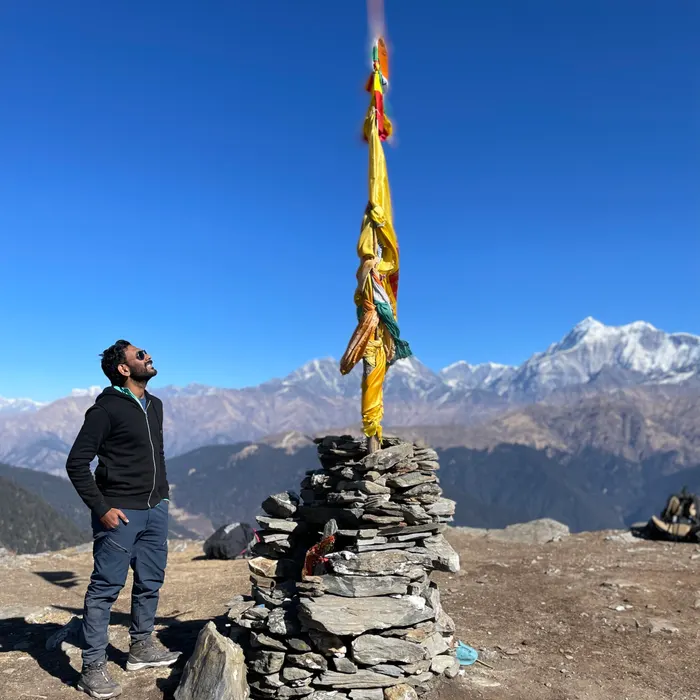Banu at a summit cairn on the Brahmatal trek